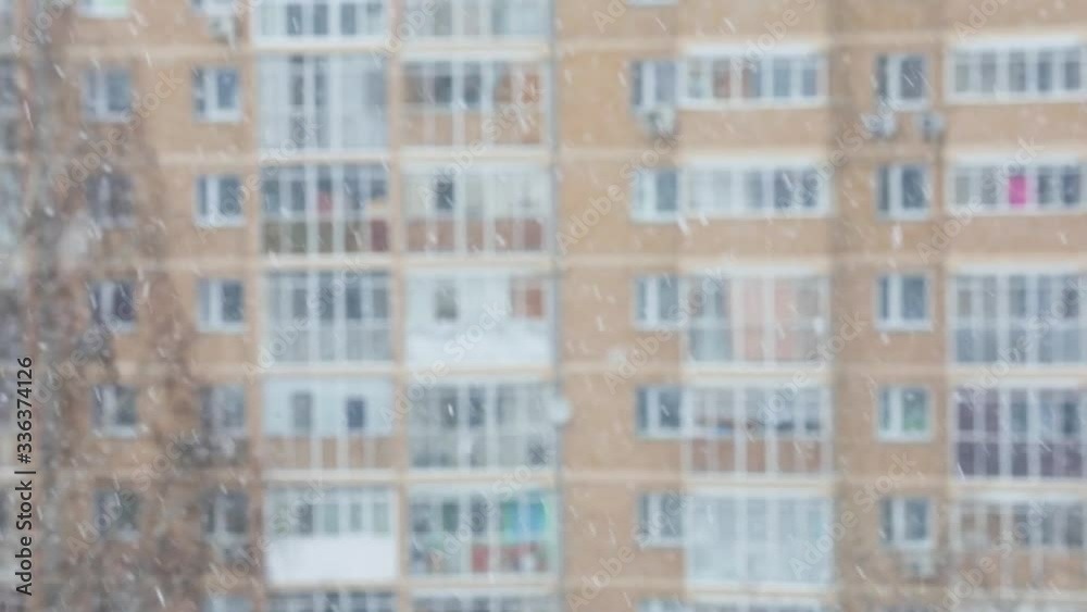 Snowfall in a city. Simple scene - falling snowflakes on a cityscape background. Snowfall in a city. Simple scene - falling snowflakes on a cityscape background.