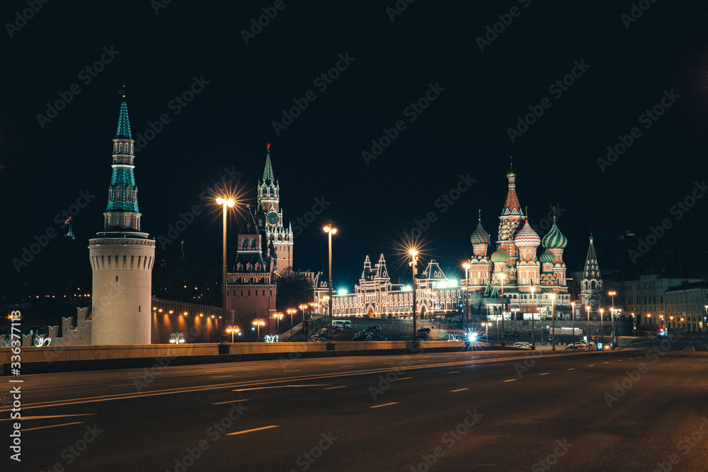 Moscow, Russia - Red square view of St. Basil's Cathedral in the night, the Red square and the bridge are empty due to a quarantine