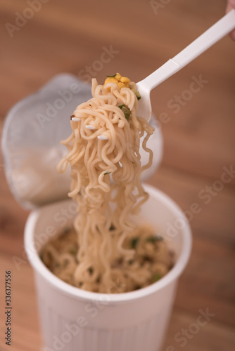 Noodle Cup,noodle soup in a cup,on wooden background photo