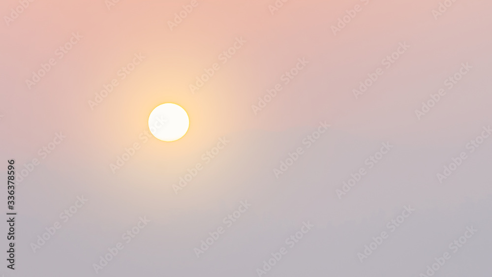 The sun in the sky that is colorful and natural.