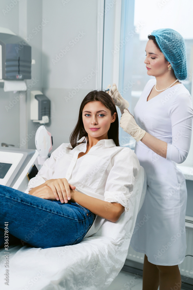 Fototapeta premium Plasmolifting of the scalp - in the case of the initial stages of baldness and to improve the condition of the hair. Bio revitalization of hair skin