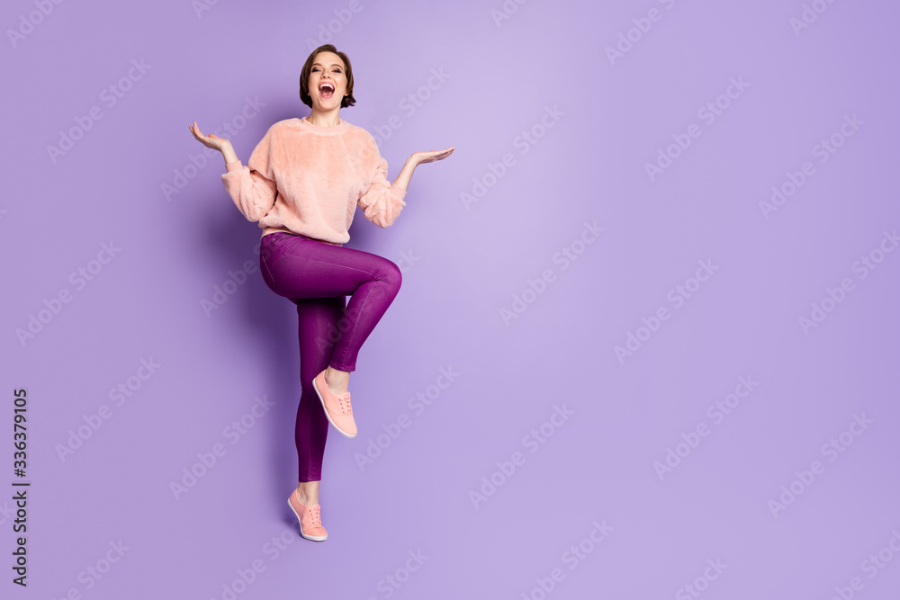 Full length photo of cheerful girl have fun on fall winter holidays fooling laughing feel rejoice wear casual style outfit isolated over purple color background Full length photo of cheerful girl have fun on fall winter holidays fooling laughing feel rejoice wear casual style outfit isolated over purple color background