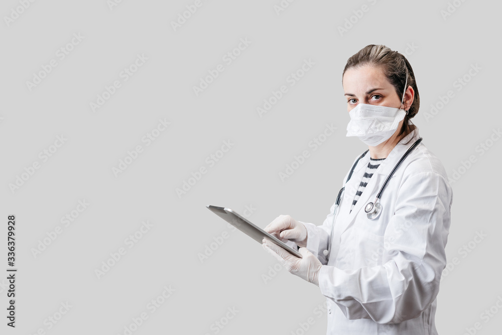 doctor holding a tablet on a white background