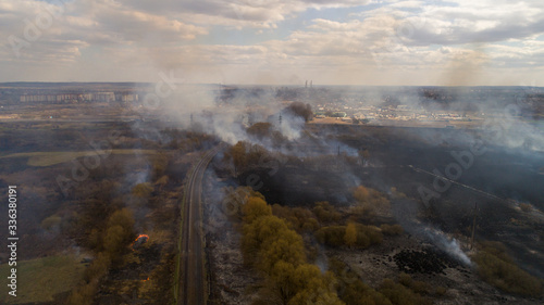 Large-scale fire in the field. Grass burns, lots of smoke. Ukraine. Rivne.