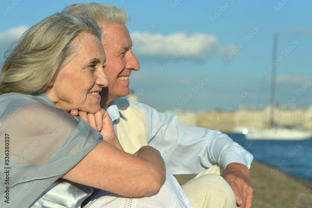 Portrait of happy elderly couple on beach