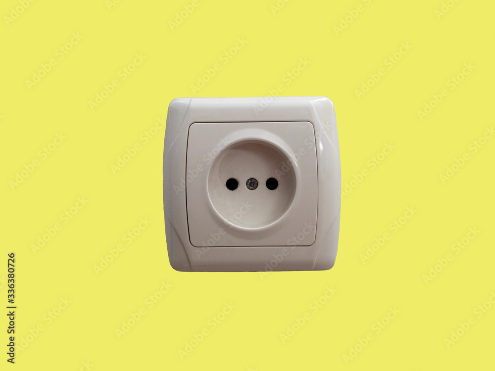 Electric socket isolated on a yellow background Electric socket isolated on a yellow background