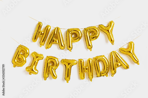 Fotografia Happy birthday lettering made of golden balloons on a white background