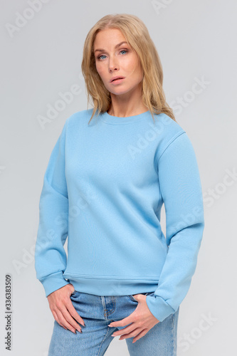 Blank sweatshirt mock up isolated. Female wear plain hoodie mockup. Plain hoody design presentation. Clear loose overall model. Pullover for print. Woman clothes sweat shirt template sweater wearing photo