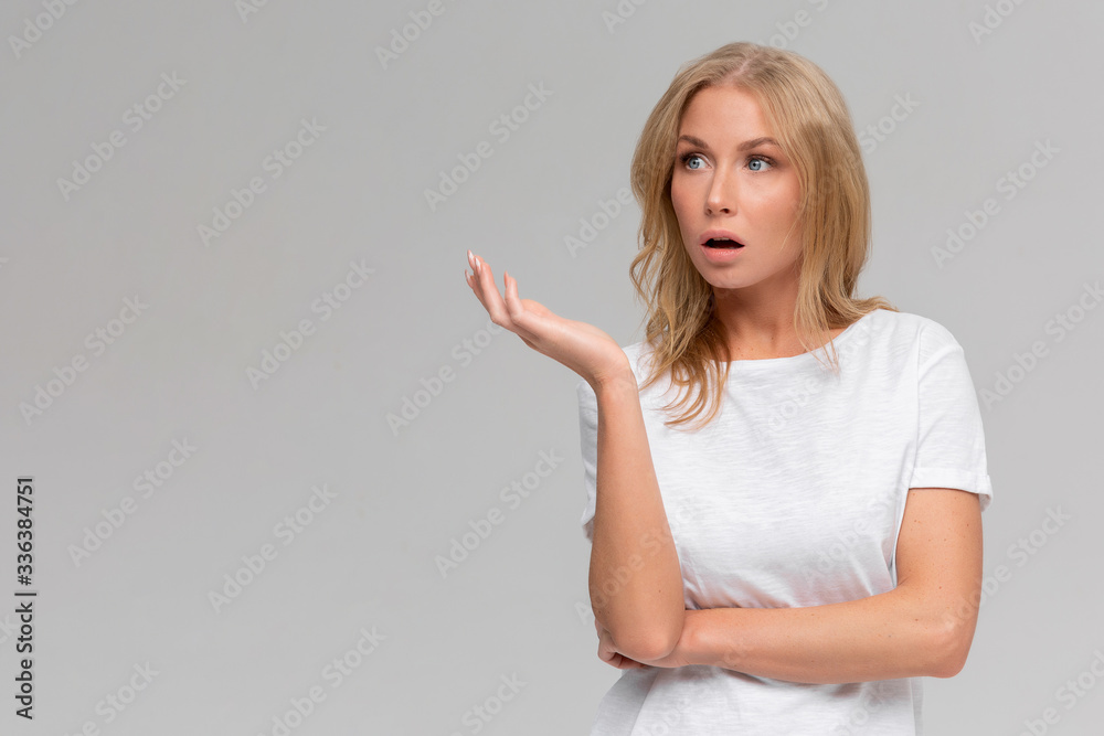 Wtf are you talking about. Portrait of displeased pissed european female, standing in angry pose, shaking hands and gesturing, being clueless and questioned, standing puzzled over grey wall Wtf are you talking about. Portrait of displeased pissed european female, standing in angry pose, shaking hands and gesturing, being clueless and questioned, standing puzzled over grey wall