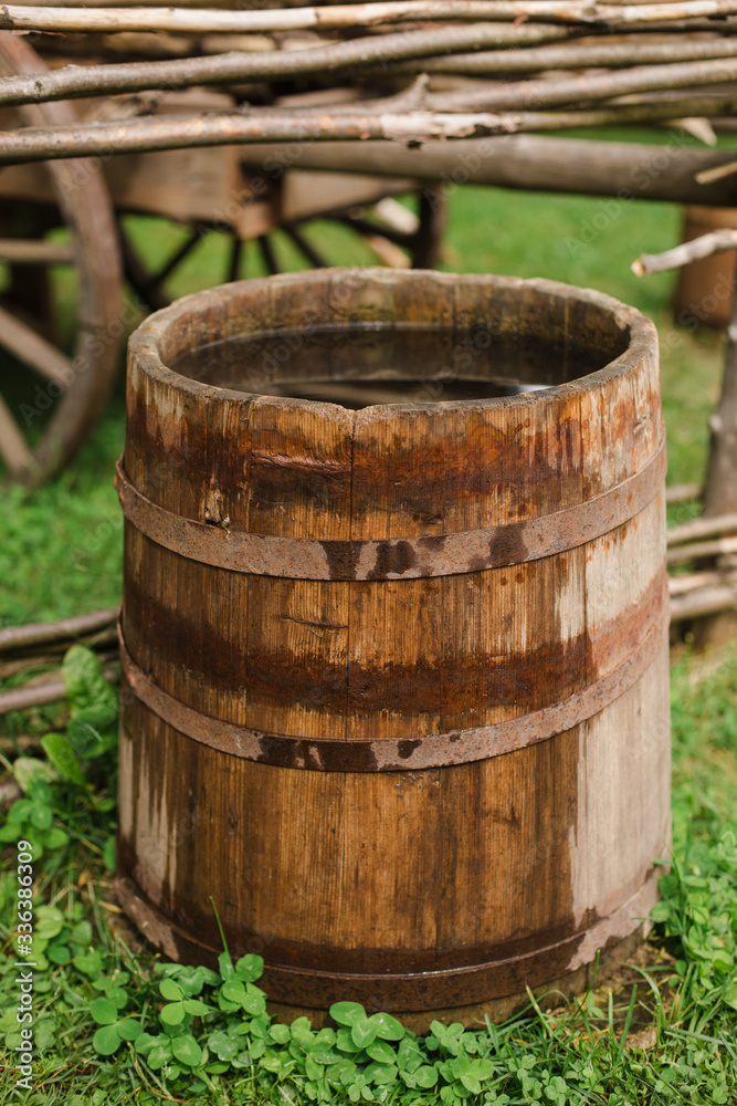 water barrels in the garden on the grass. water barrels in the garden on the grass.