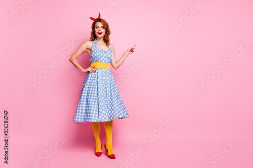 Full length photo of astonished lady promoter point index finger copyspace impressed by incredible discount scream wow omg wear blue headband yellow stockings isolated pink color background