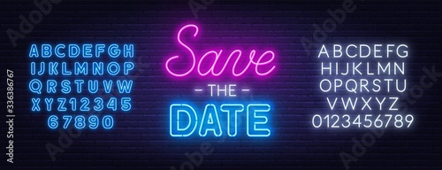 Save the date neon lettering on brick wall background. Neon alphabet on brick wall background.
