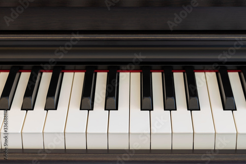 dark wooden grand piano keyboard. music instrument.