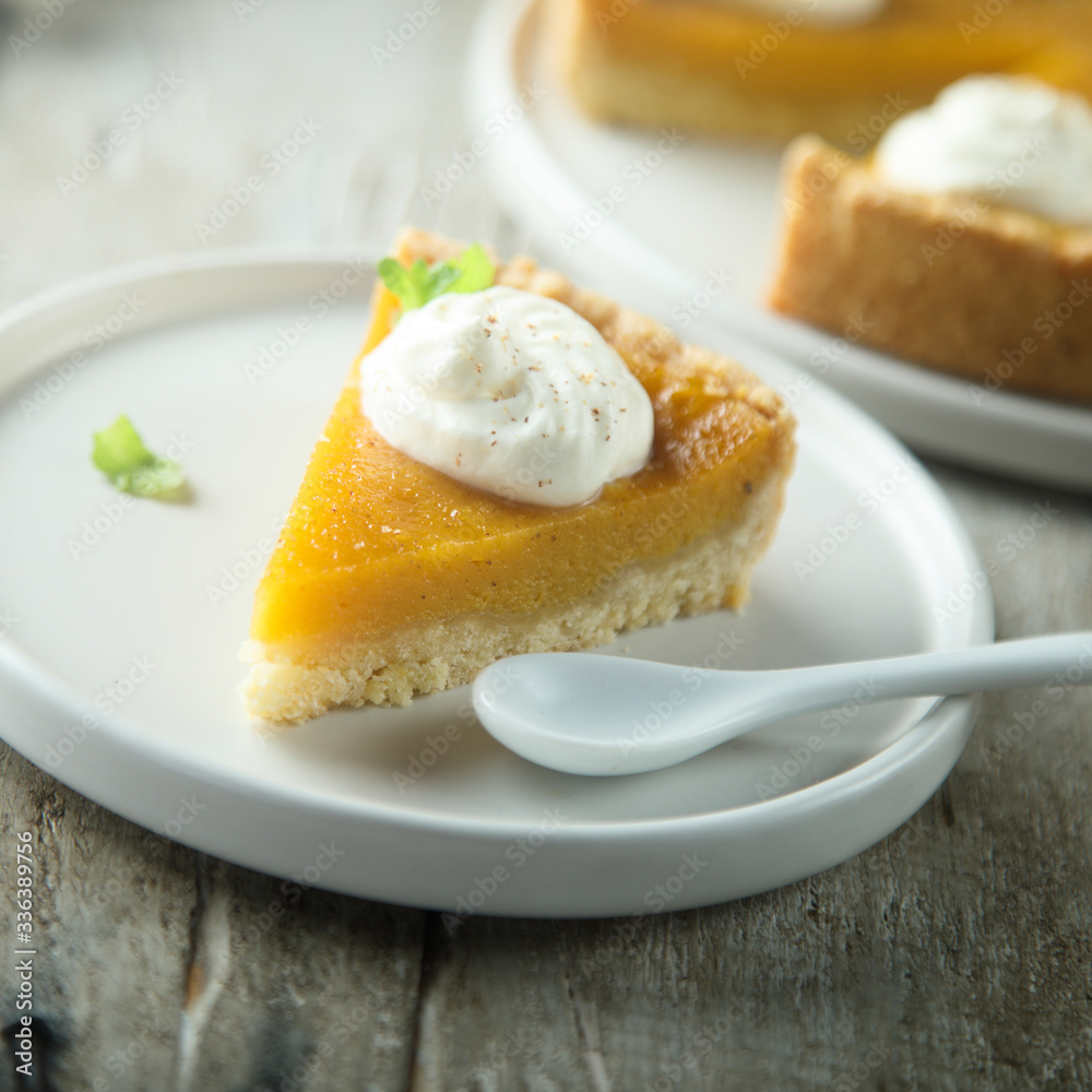 Homemade pumpkin pie with whipped cream Homemade pumpkin pie with whipped cream