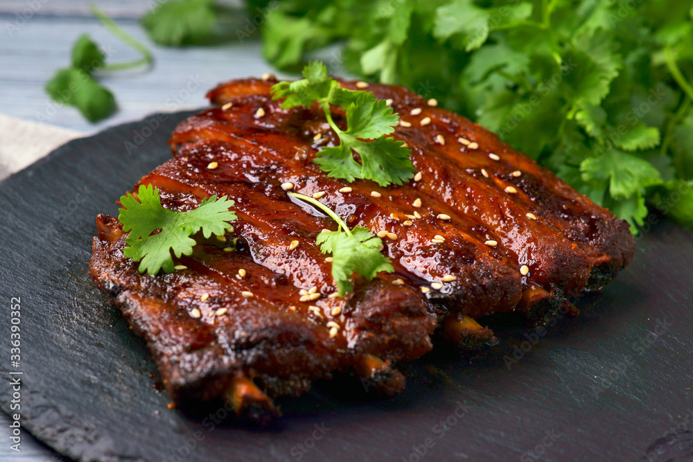 grilled pork ribs on a wooden background grilled pork ribs on a wooden background