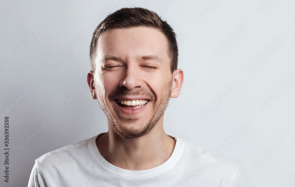 Laughing happy guy with closed eyes Laughing happy guy with closed eyes