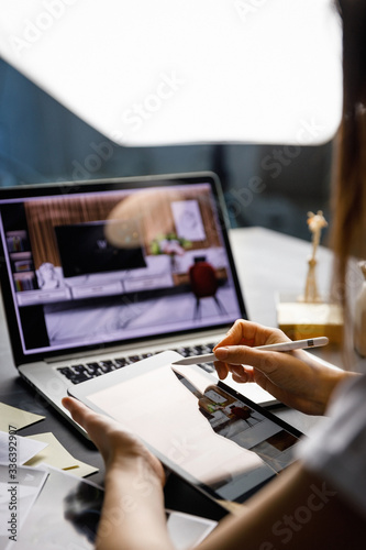 Graphic designer drawing sketch design creative Ideas draft Logo product trademark label brand artwork architecture plan. Graphic designer studio and workspace concept.