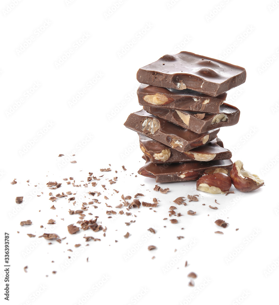 Fototapeta premium Sweet chocolate with nuts on white background