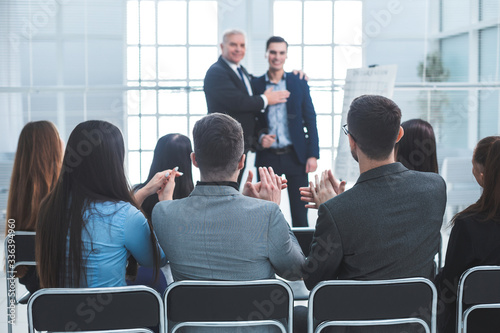 project Manager congratulating the best employee of the company
