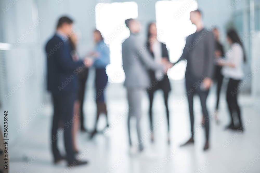 background image of a group of business people in the office lobby