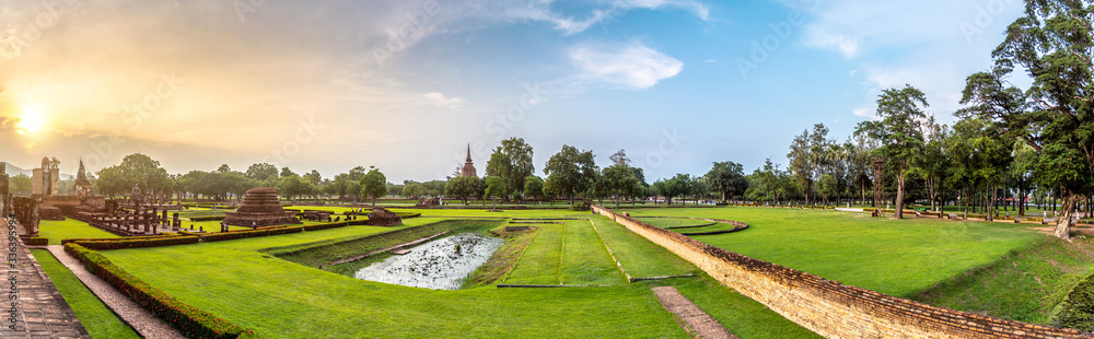 Panorama of Sukhothai Historical Park in the evening with beautiful sunset sky (Sukhothai, Thailand)