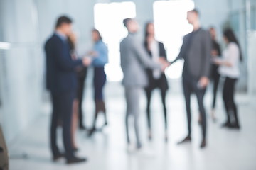 background image of a group of business people in the office lobby