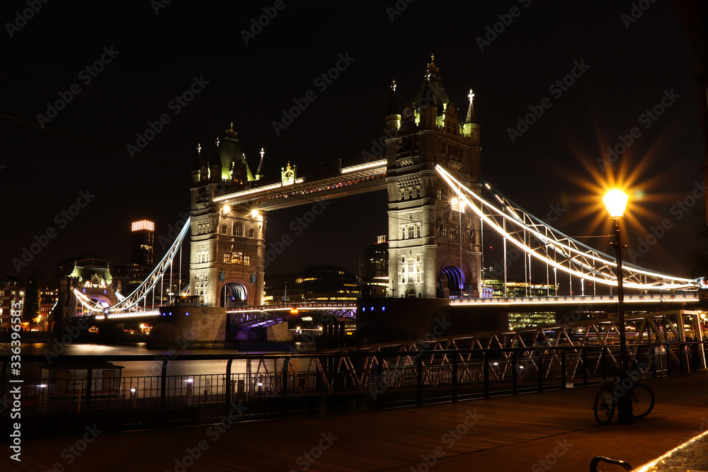 Obraz premium Wonderful national monument in London at midnight. Tower bridge in night only with artificial light. Unique lifting bridge across the river Thames in dark mode. Tower Bridge with LED lighting