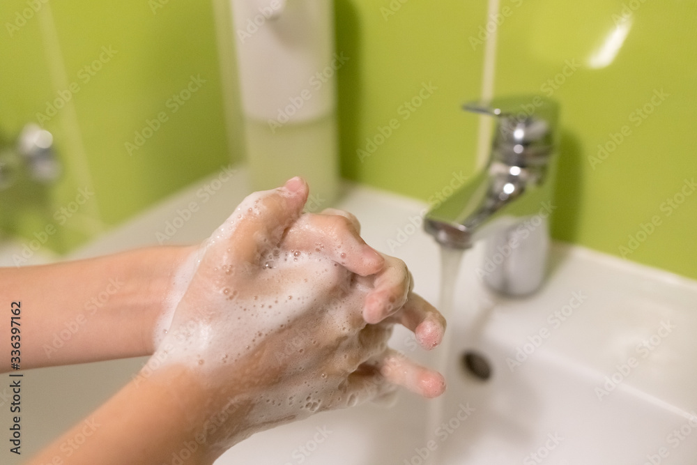 Boy is washing hands rubbing with soap for coronavirus prevention, hygiene to stop spreading coronavirus Boy is washing hands rubbing with soap for coronavirus prevention, hygiene to stop spreading coronavirus