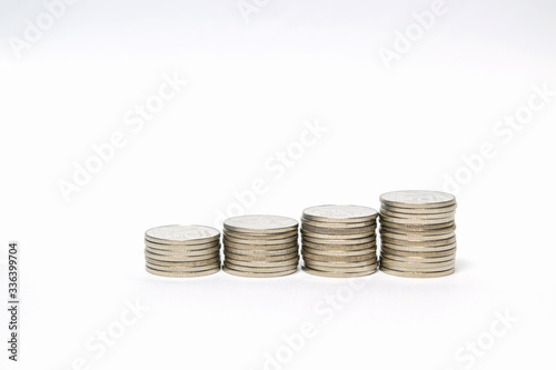 Concept save money many Silver coin monetary or change coin, on white background 