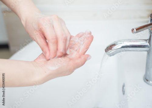Women are washing their hands with disinfectant foam to keep the virus healthy.