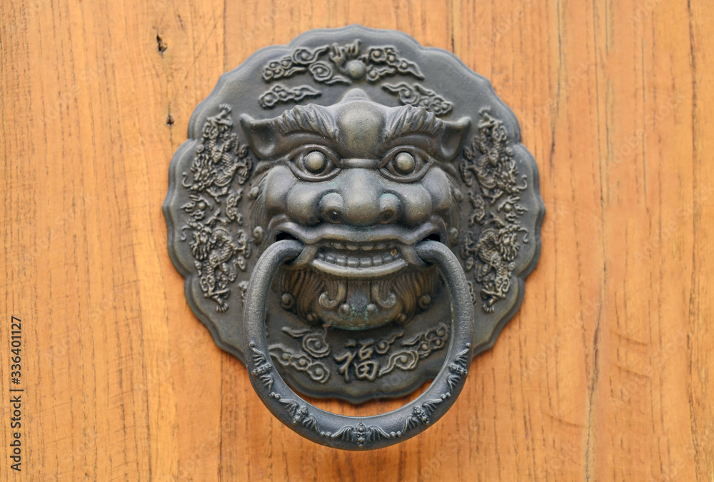 Metal doorrings for the heads of monsters in traditional Chinese Architecture