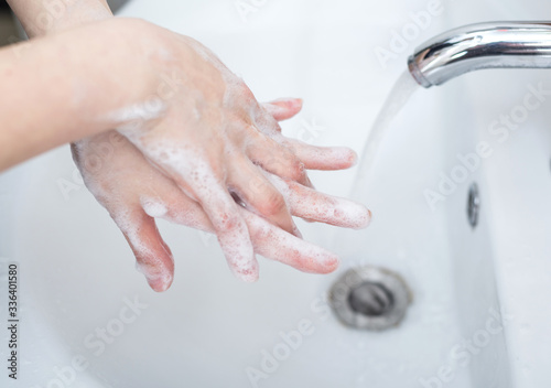 Women are washing their hands with disinfectant foam to keep the virus healthy.