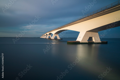 Beautiful long Zeeland bridge leading over the sea in Holland.