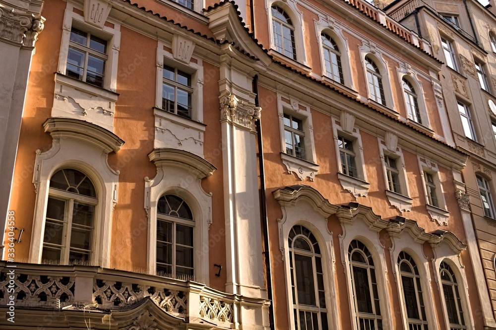 Old orange building with decorated windows (Prague, Czech Republic, Europe)
