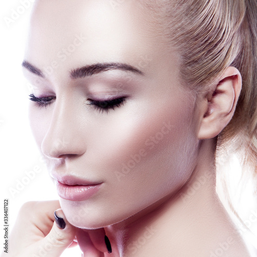 Close-up beauty modern woman face, perfect skin, nude makeup, eye shadow, closed eyes