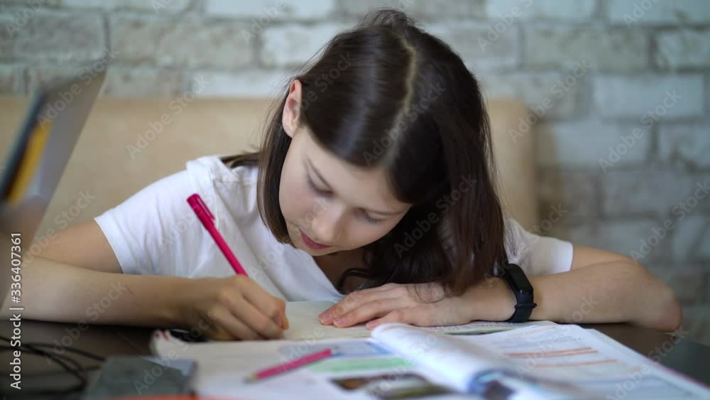 Smart schoolgirl studying at home during coronavirus pandemic Smart schoolgirl studying at home during coronavirus pandemic