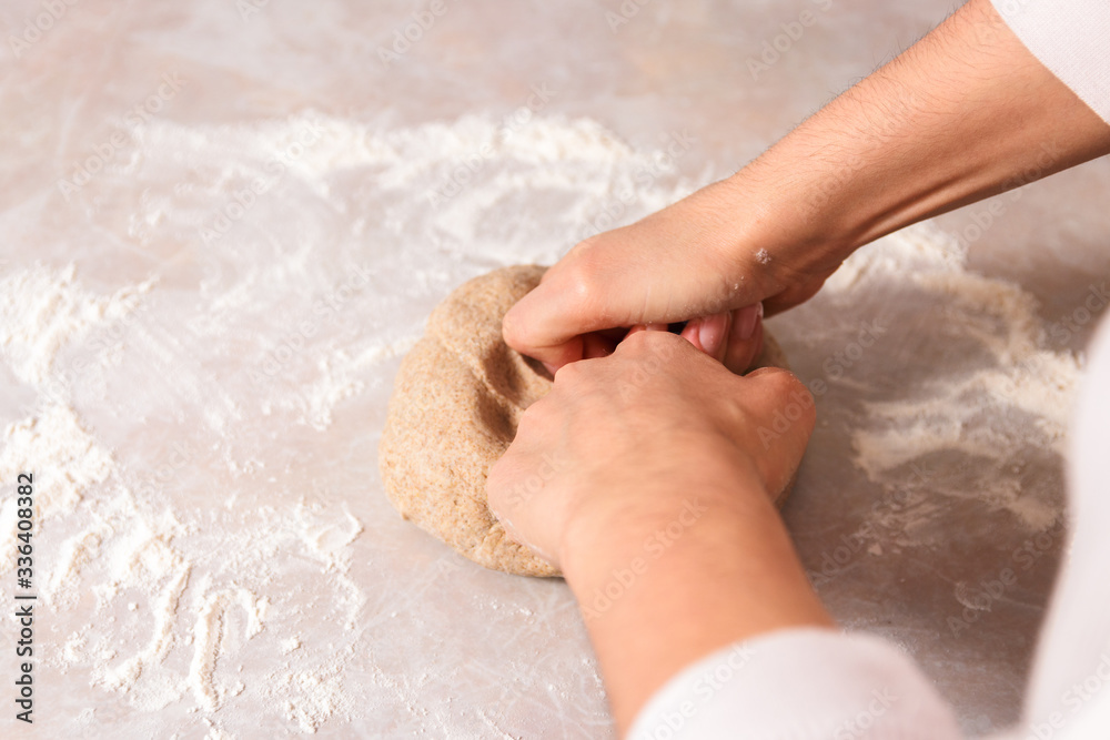 process of baking health bread at home. closeup woman hands kneading dough from rye flour on marble countertop in bright kitchen process of baking health bread at home. closeup woman hands kneading dough from rye flour on marble countertop in bright kitchen