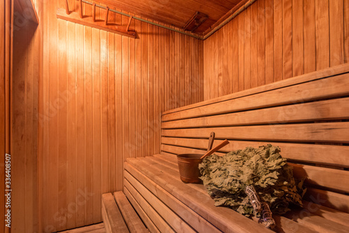 sauna bathhouse warm interior inside empty brooms barrels bucket for water photo