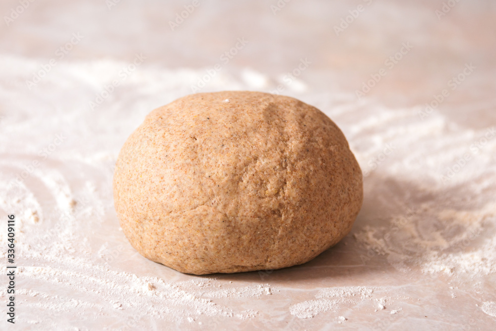 kneaded dough ball from rye flour on marble countertop ready to go in oven kneaded dough ball from rye flour on marble countertop ready to go in oven