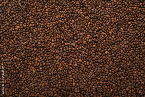 Fresh roasted coffee beans background, top view