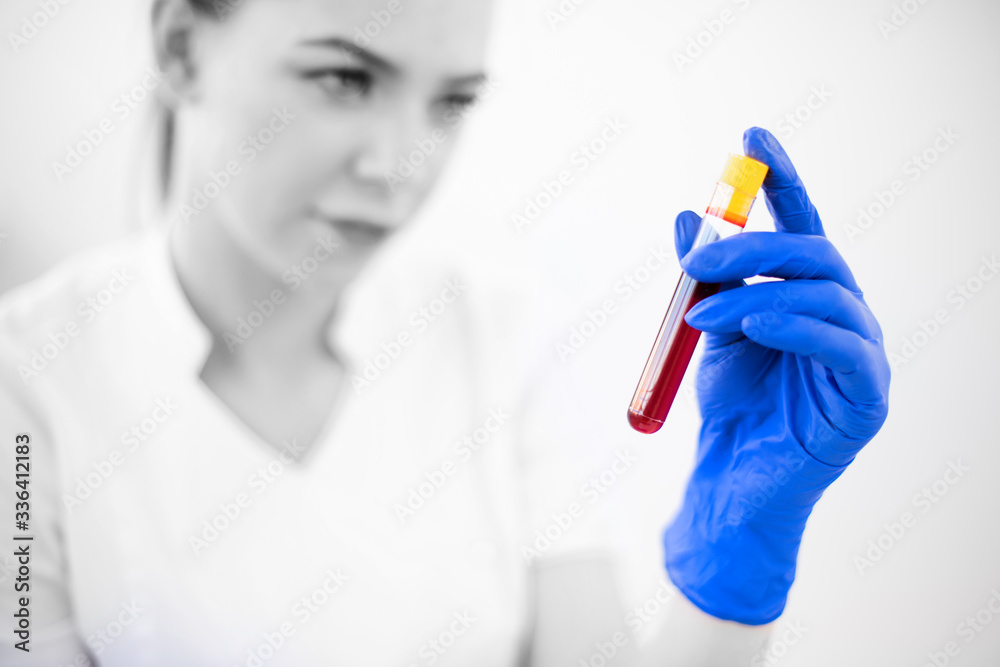 Female doctor nurse holding protective blood samples