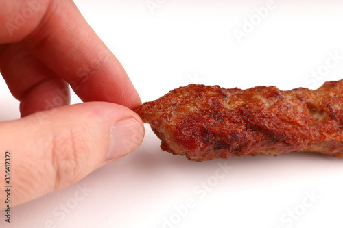 Lyulya kebab Delicious meat on a stick in hand photo