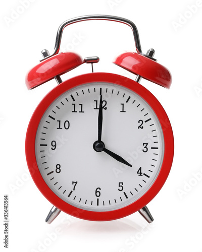 Red alarm clock set at four isolated over white background photo