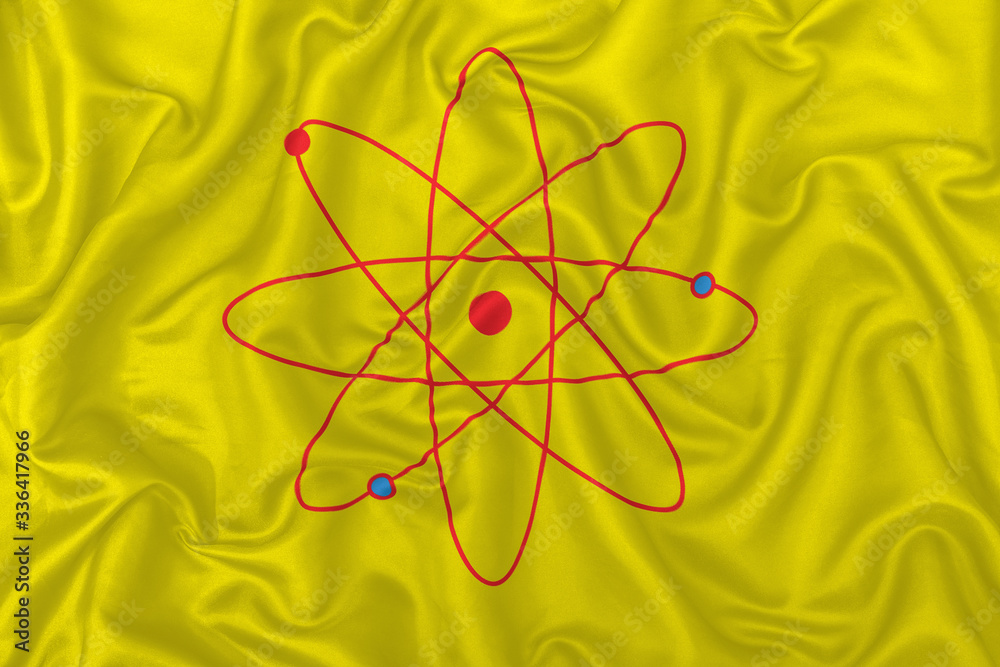 Atom sign in yellow fabric Atom sign in yellow fabric