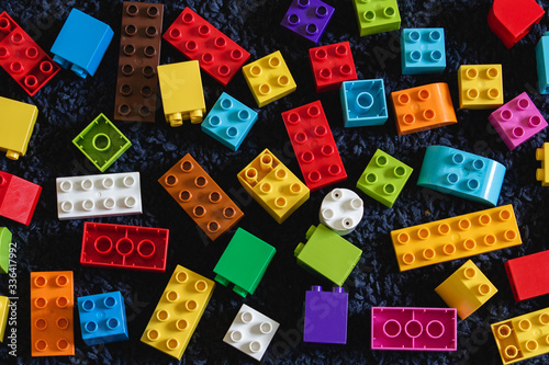Colorful brick toys on the dark floor mat