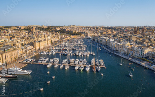Aerial top view of Birgu city - one of three cities landmark on Malta country. Marina bay, yachts, boats