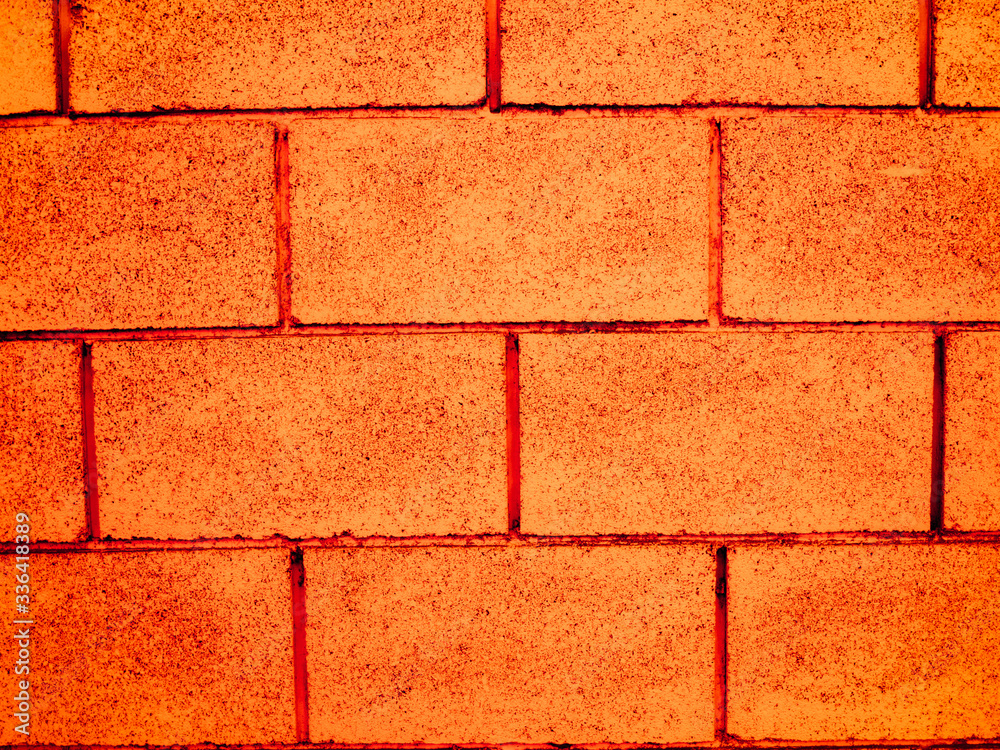 Fototapeta premium Texture of an orange brick wall.