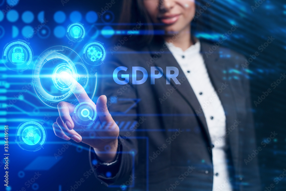 Obraz premium Business, Technology, Internet and network concept. Young businessman working on a virtual screen of the future and sees the inscription: GDPR