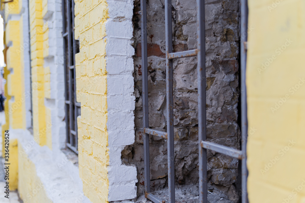 iron fence on windows during renovation of building