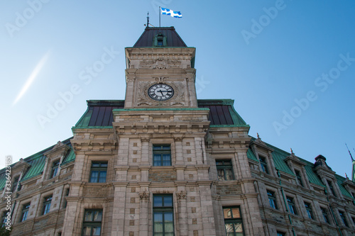 The old post office with its clock tower and monument to Samuel de Champlain, founder of Quebec City by Paul Chevré in 1898.